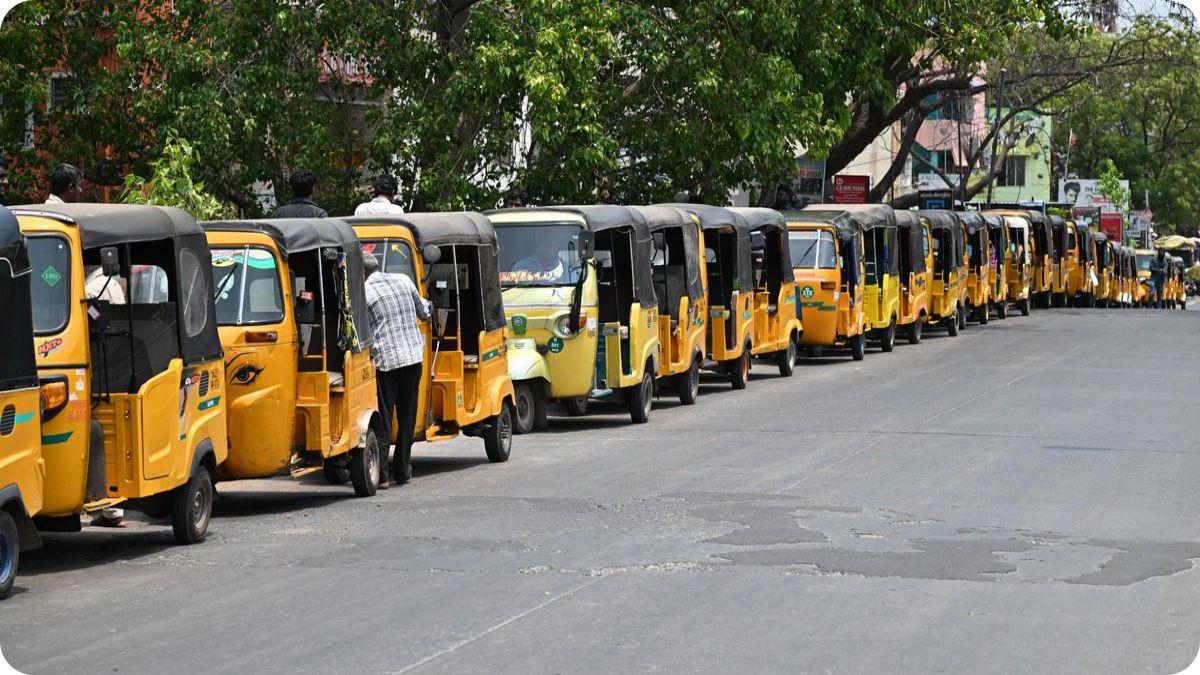 Long line of auto-rickshaws waiting at an LPG dispensing station in Chennai.