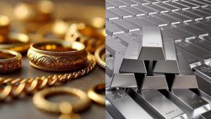 Stack of gold coins and silver bars with a downward arrow indicating a price drop.