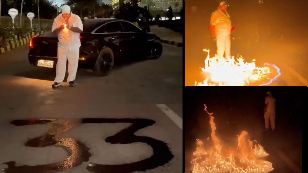 A frame from a viral video showing fire on a Mumbai road in the shape of the number 33.
