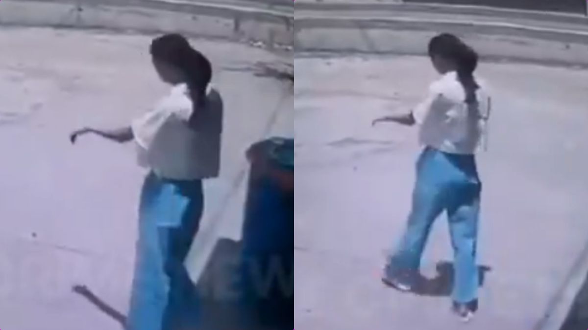 Viral CCTV footage still of Sanjivani Varade walking with a raised hand in a trance-like state.