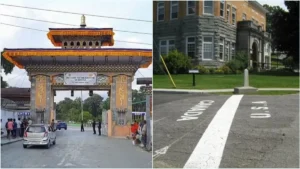 A scenic view of an international border crossing checkpoint with clear dividing lines between two countries.