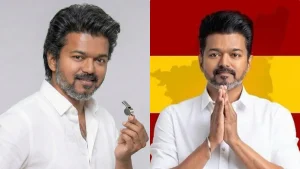 Actor-politician Vijay addressing a massive crowd during a political rally in Tamil Nadu with TVK flags.