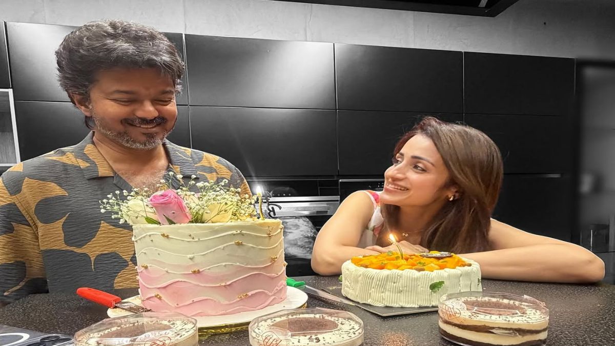 Leading South Indian actress sharing a joyful milestone celebration photograph online next to a customized tier-cake arrangement.
