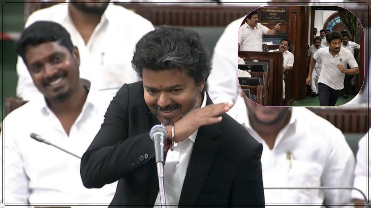State leader smiling confidently while addressing the legislative assembly podium with mic arrangements.