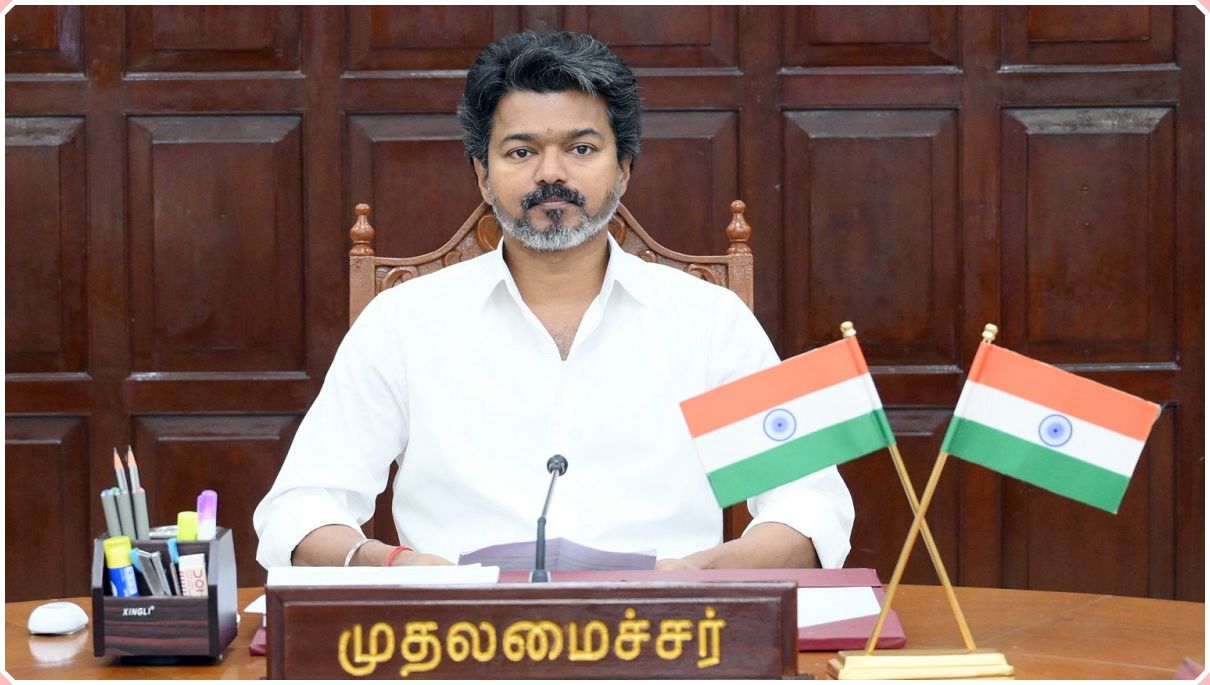Chief Minister Vijay holding a high-level administrative law and order security review profile layout with state secretaries inside the secretariat briefing room.