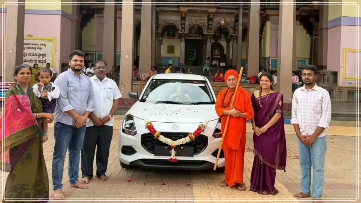 A high-quality premium editorial photo layout capturing a sleek brand-new dark colored sedan car decorated with traditional floral garlands parked outside an academic assembly building.