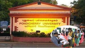 A high-quality premium architectural view of the main administrative building and campus entrance of Pondicherry University under bright daylight.