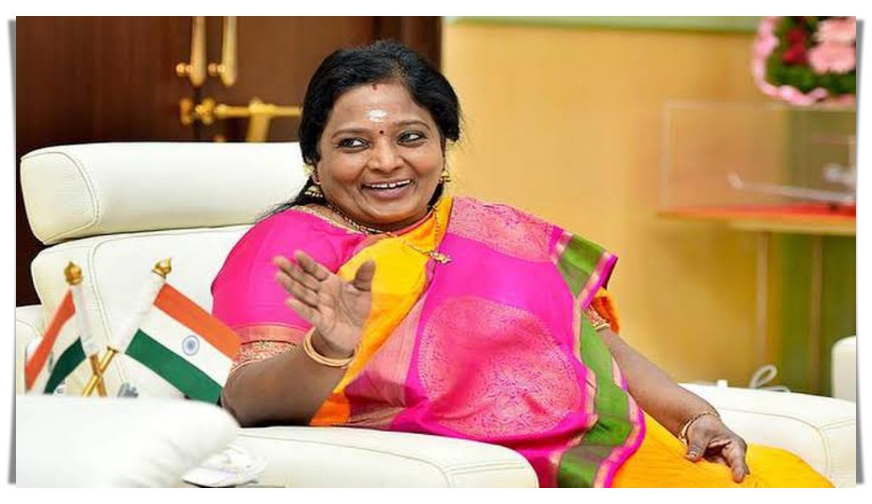 Confident female regional politician gesturing expressively during an intense media interaction panel.