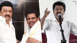 Minister Anitha Radhakrishnan delivering an aggressive political speech at a DMK public meeting podium.