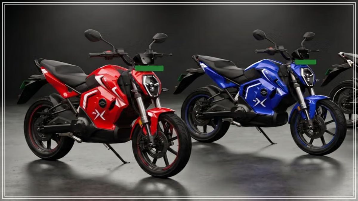 A sleek, sporty electric motorcycle standing under professional studio lighting.