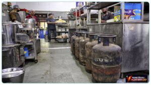 Commercial 19 kg LPG cylinders stacked at a supply warehouse in Chennai.